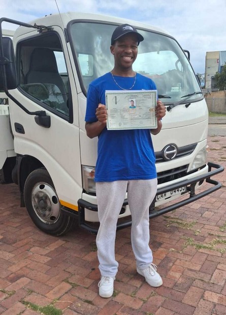 Group of A+ learners celebrating their driving achievements